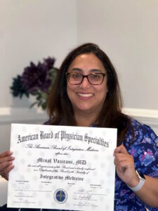Dr Minal Vazirani holding Board Certification Certificate