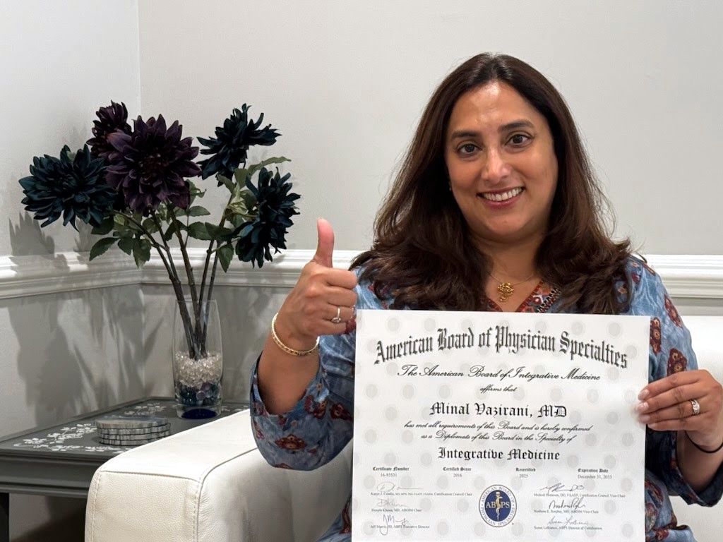 Dr Minal Vazirani holding Board Certification Certificate
